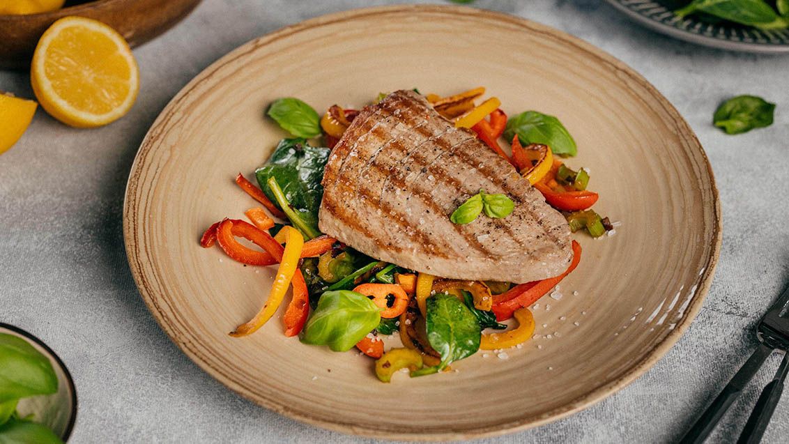 Tuna Steak with Sautéed Peppers, Olives and Spinach
