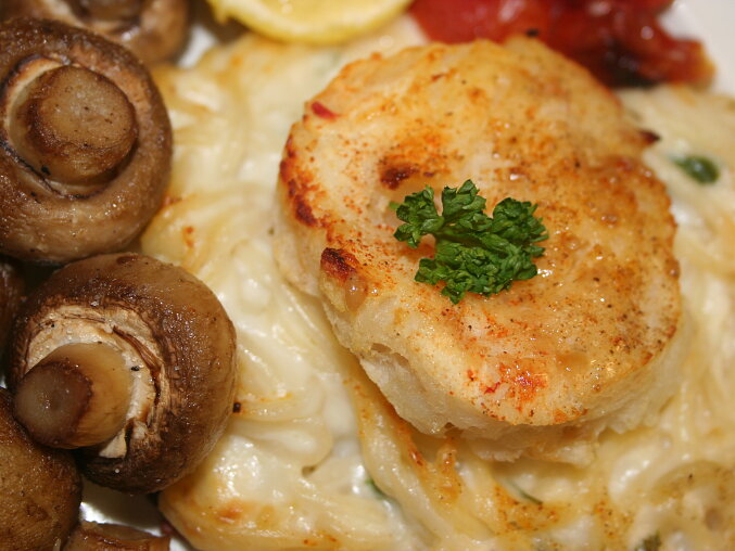 Fish Fillet on a Cheese Nest with Roasted Mushrooms