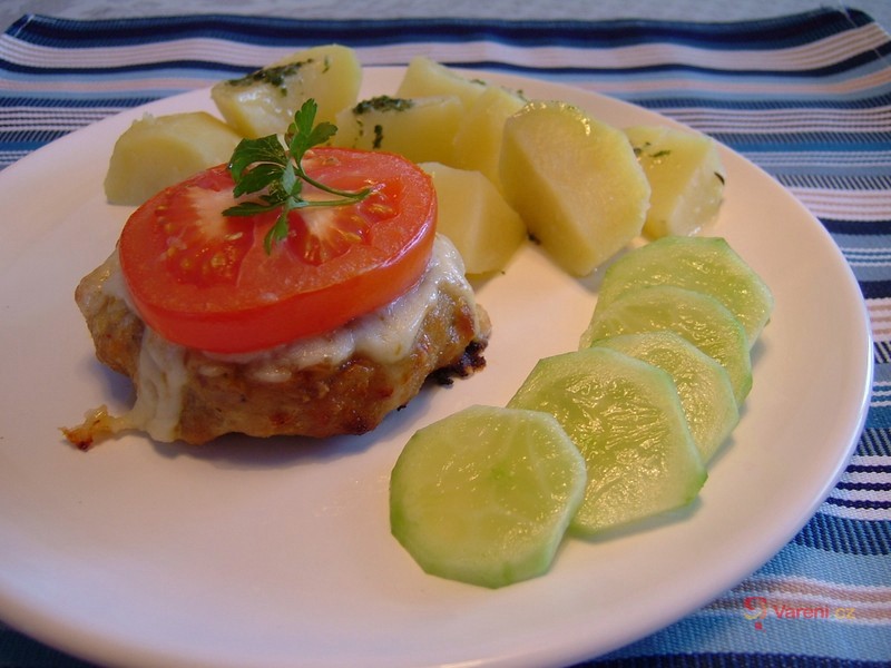 Baked Meat Patties Topped with Tomatoes and Cheese