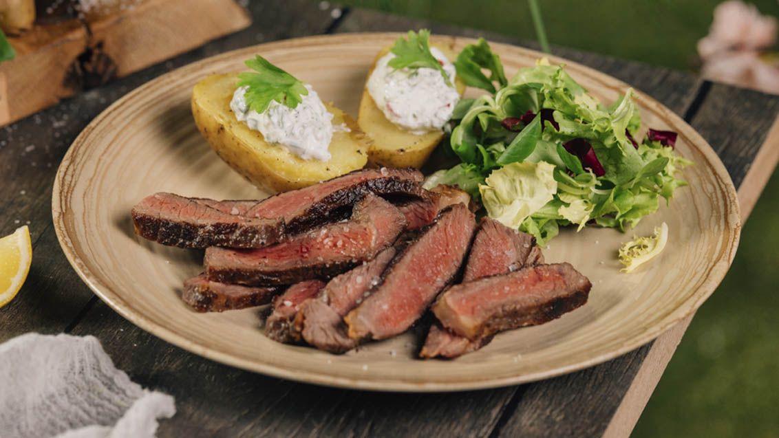 Rib-Eye Steak with Foil-Baked Potatoes, Sour Cream and Leaf Salad