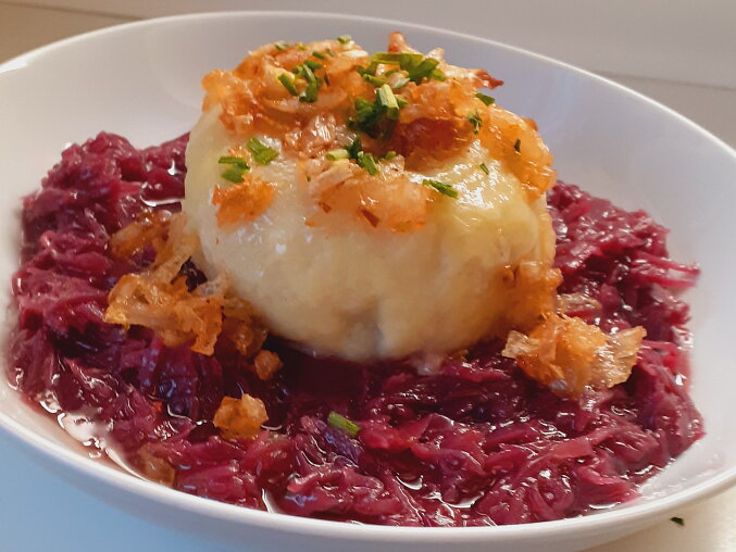 Potato Dumplings Stuffed with Minced Meat on Red Cabbage