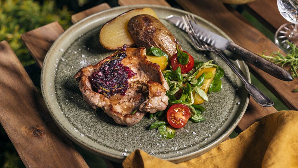 Grilled Pork Neck with Onion and Blueberry Sauce and Potatoes in Foil